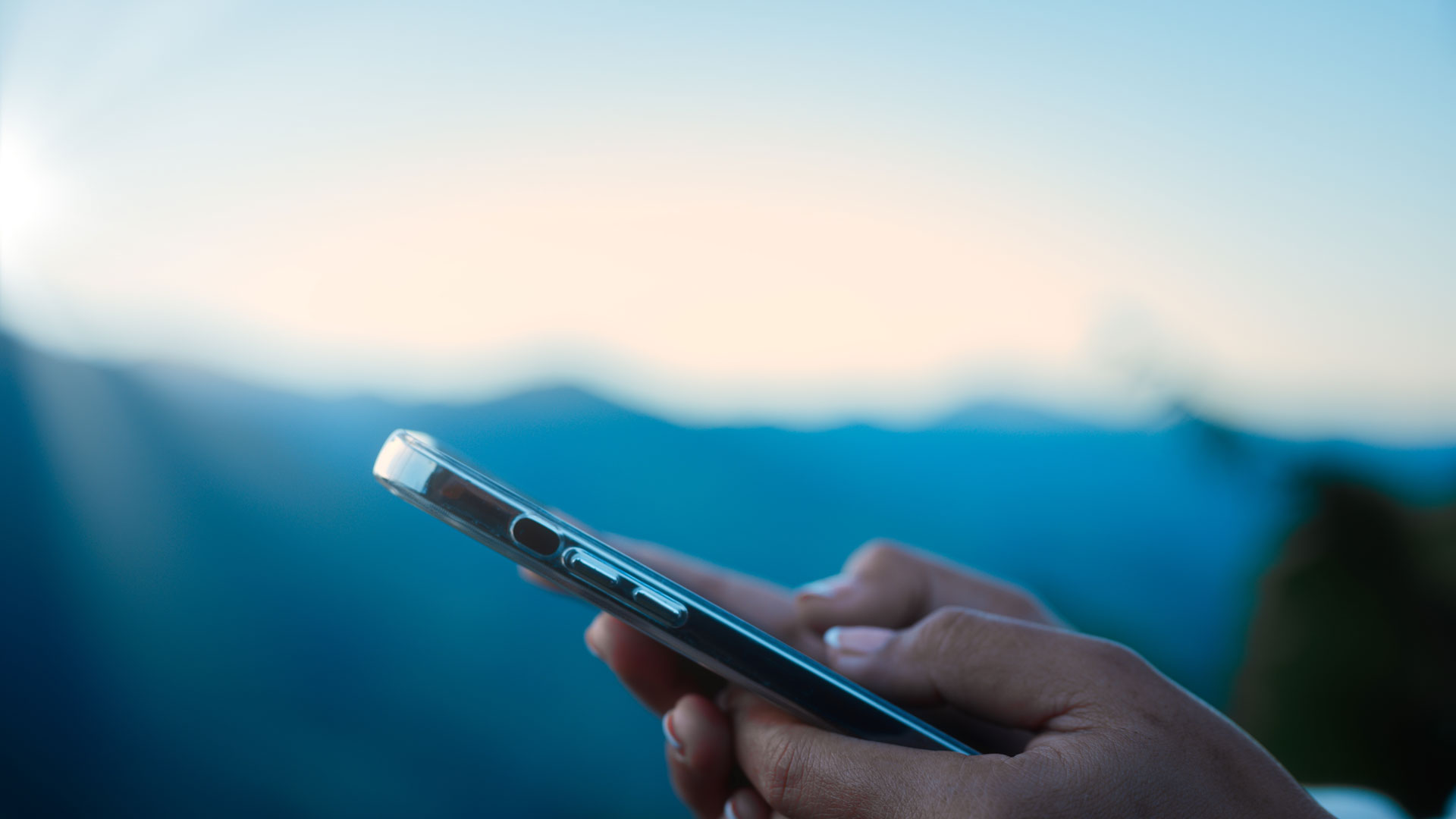 Company leader using a mobile dashboard, leveraging Jabil’s Market Sector Report for data-driven insights in the mobile device industry.